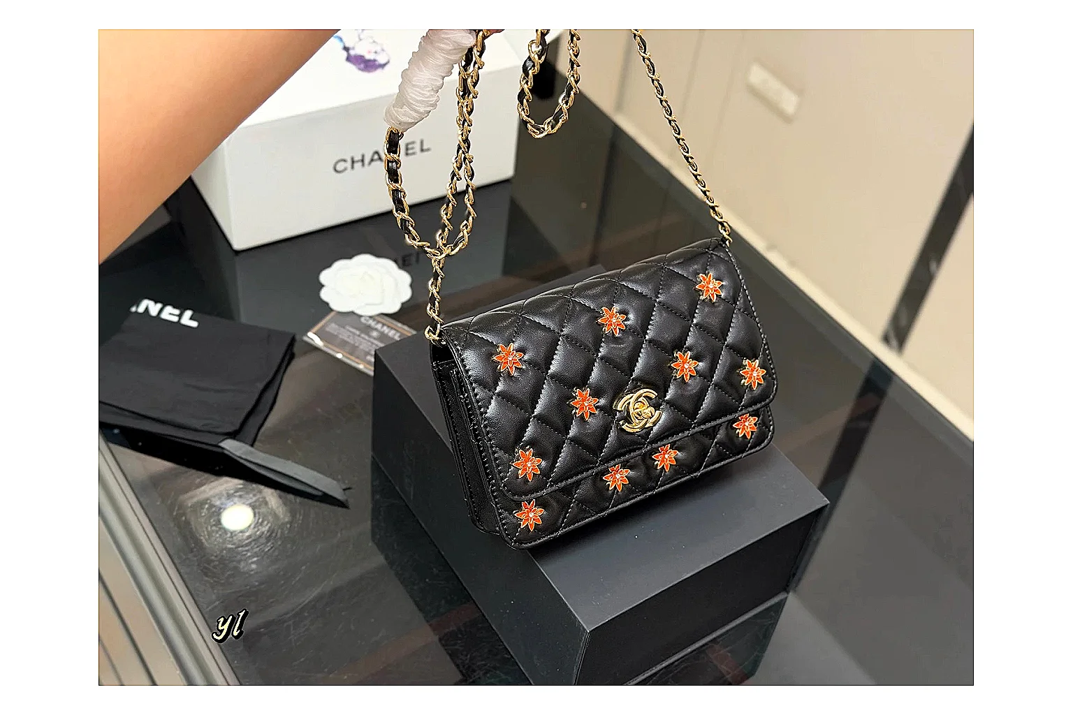 Chanel Quilted Wallet Bag Black Floral OOPBuy route photo showing black quilted wallet-bag body, floral detail, compact flap shape, and polished chain hardware thumbnail 2