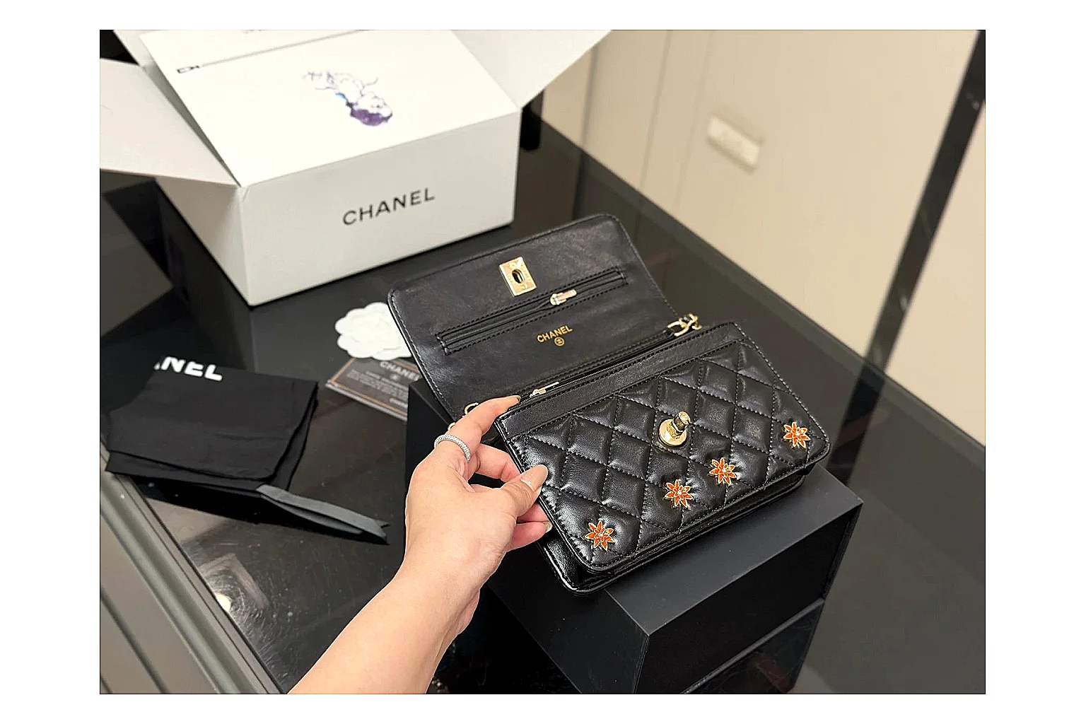 Chanel Quilted Wallet Bag Black Floral OOPBuy route photo showing black quilted wallet-bag body, floral detail, compact flap shape, and polished chain hardware thumbnail 5
