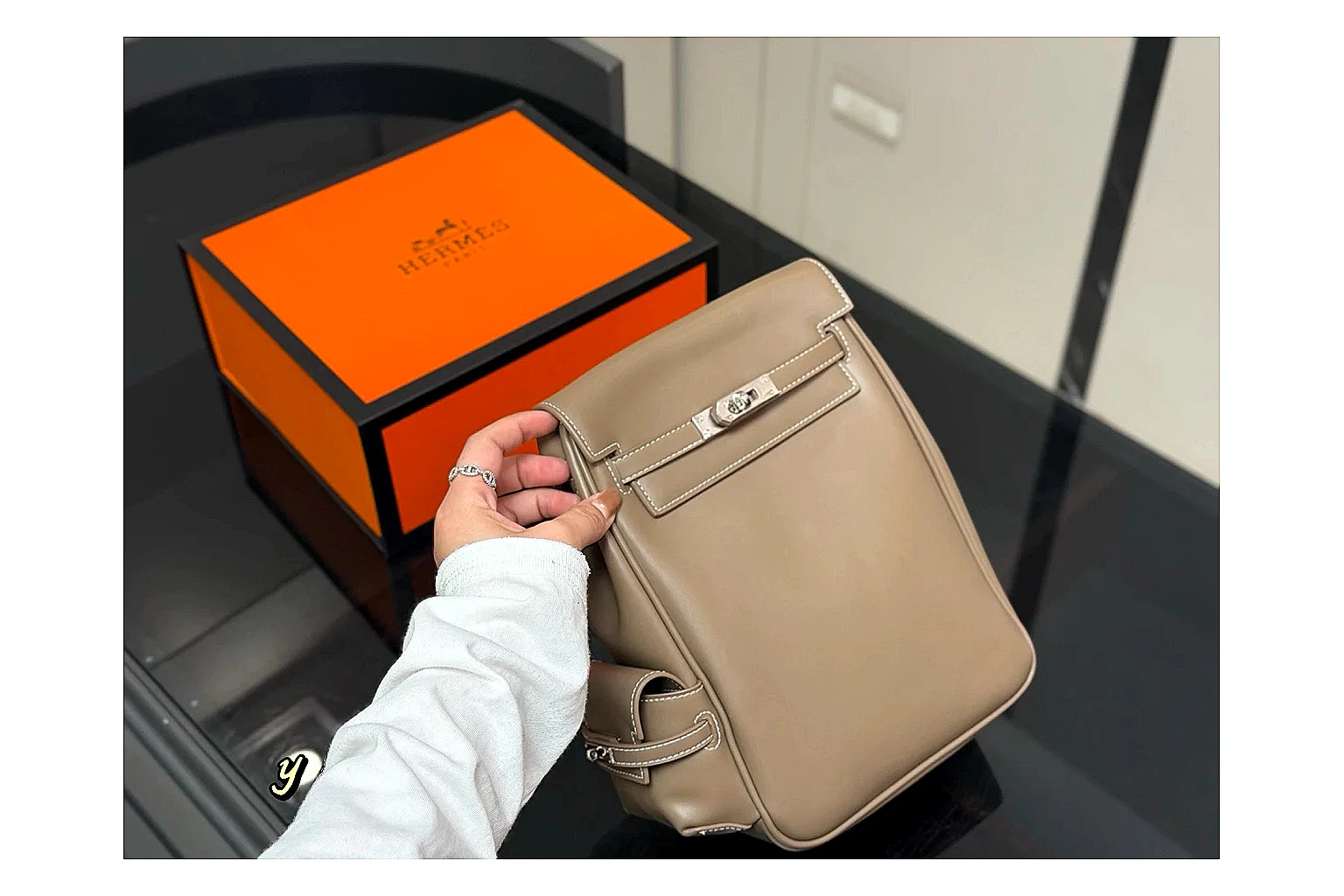 Hermes Kelly Backpack Beige OOPBuy route photo showing beige leather backpack body, Kelly-style flap, top handle, shoulder straps, and polished hardware thumbnail 2
