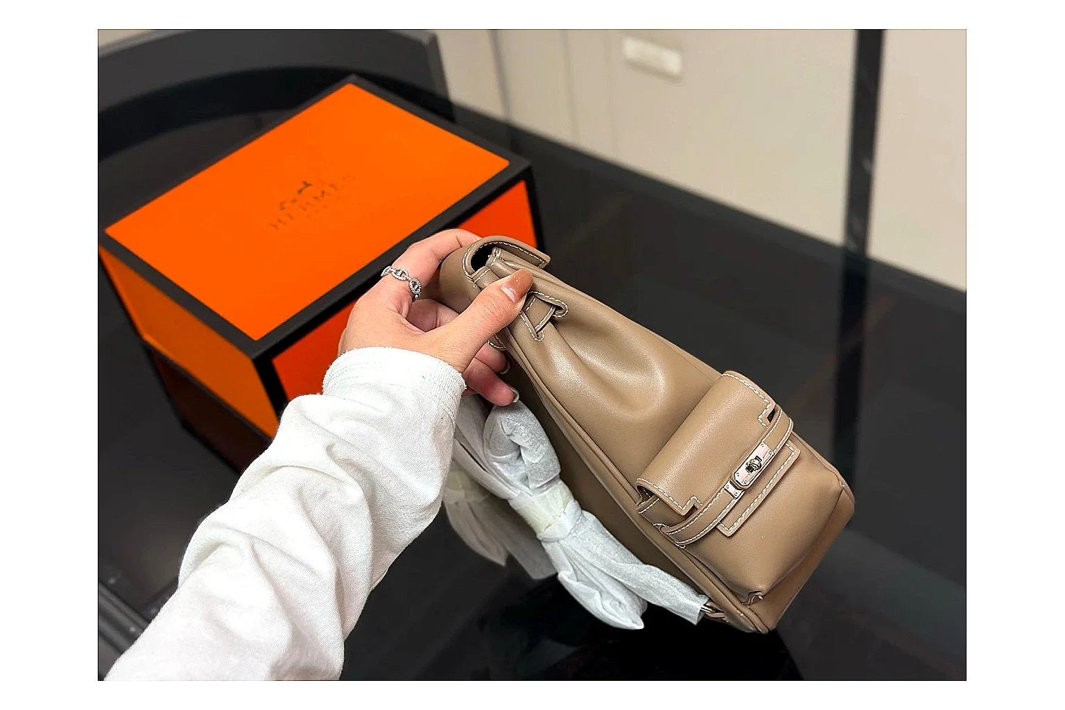 Hermes Kelly Backpack Beige OOPBuy route photo showing beige leather backpack body, Kelly-style flap, top handle, shoulder straps, and polished hardware thumbnail 6