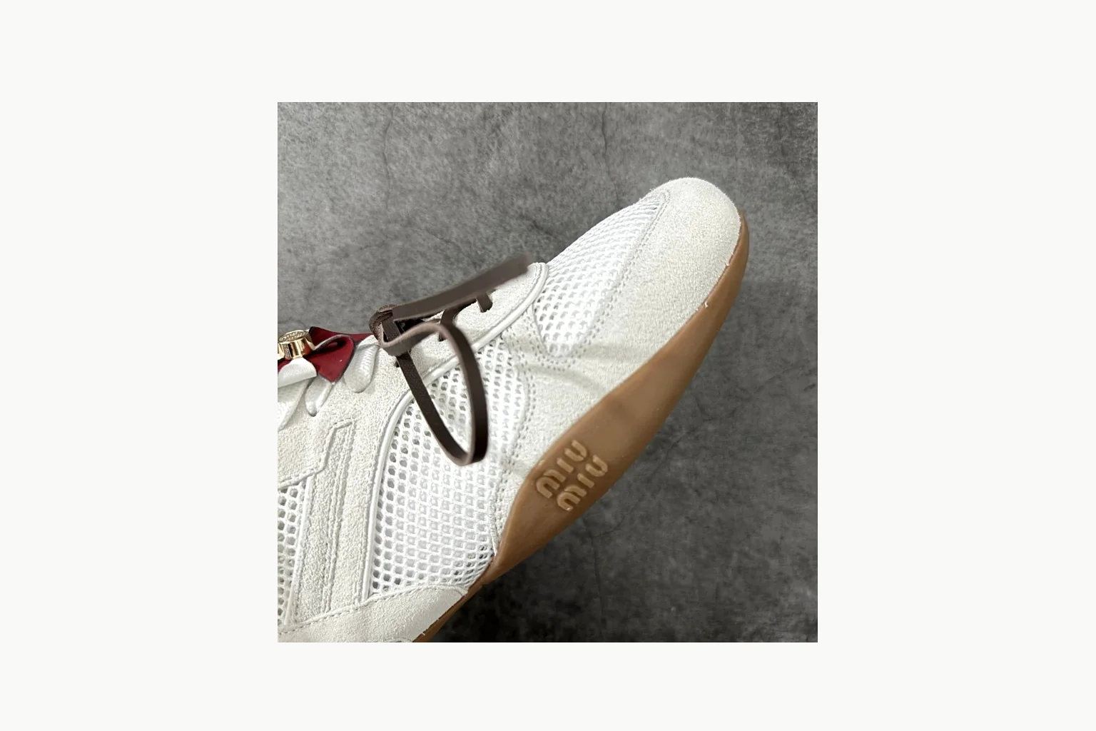 White Miu Miu low-top sneaker with bow detail, toe, heel, and sole thumbnail 6