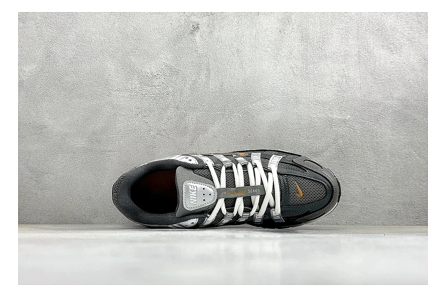 Nike P-6000 Black Orange OOPBuy route photo showing black layered runner upper, orange accent hits, retro P-6000 paneling, and cushioned casual sole thumbnail 3
