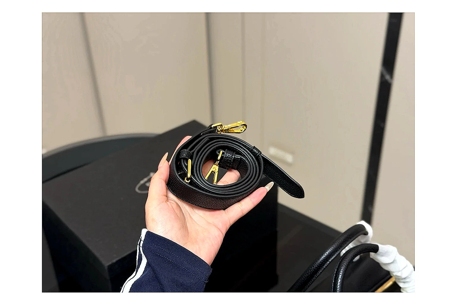 Prada Mini Top Handle Black OOPBuy route photo showing black leather mini bag body, structured top handle, compact silhouette, and clean metal hardware thumbnail 4