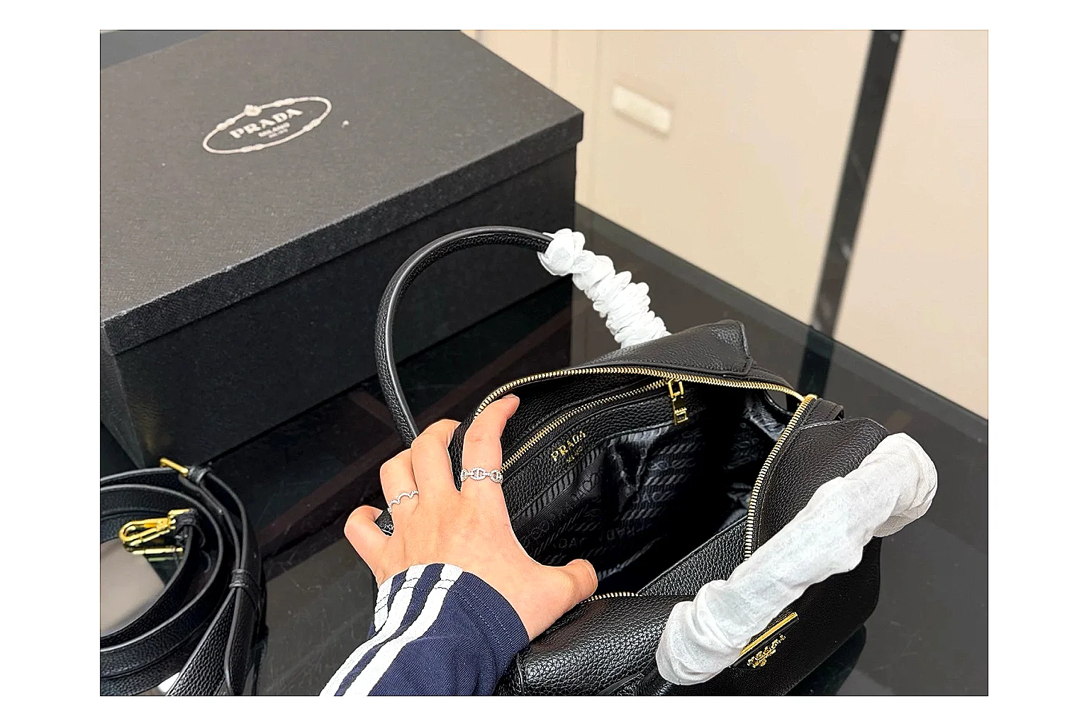 Prada Mini Top Handle Black OOPBuy route photo showing black leather mini bag body, structured top handle, compact silhouette, and clean metal hardware thumbnail 5