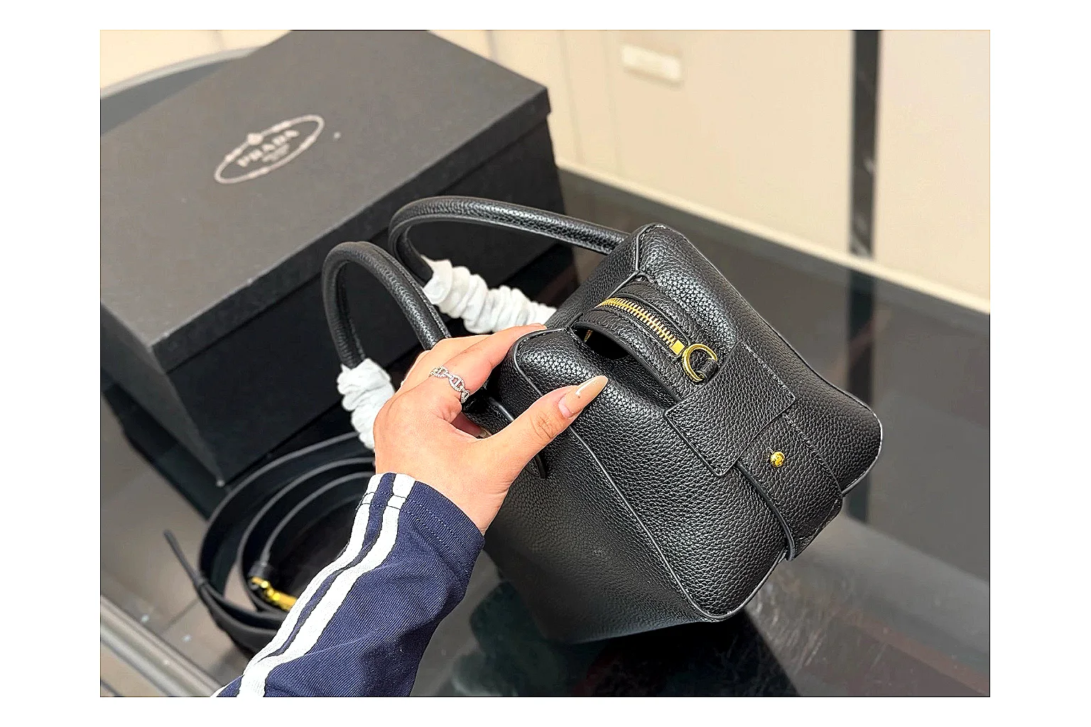 Prada Mini Top Handle Black OOPBuy route photo showing black leather mini bag body, structured top handle, compact silhouette, and clean metal hardware thumbnail 6